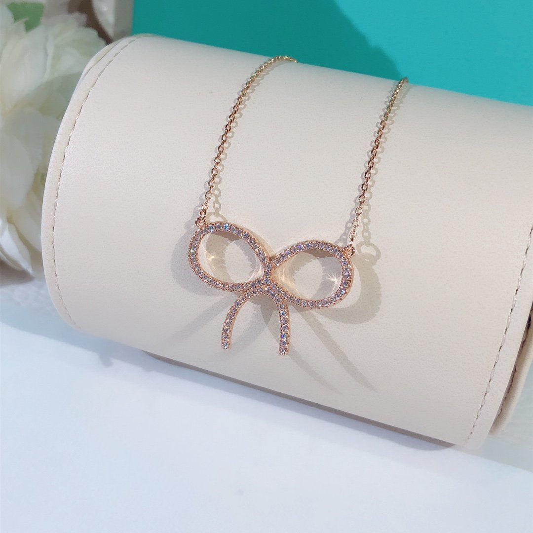 [Stellar jewels]CLAW SET RHODIUM PLATED BOW NECKLACE